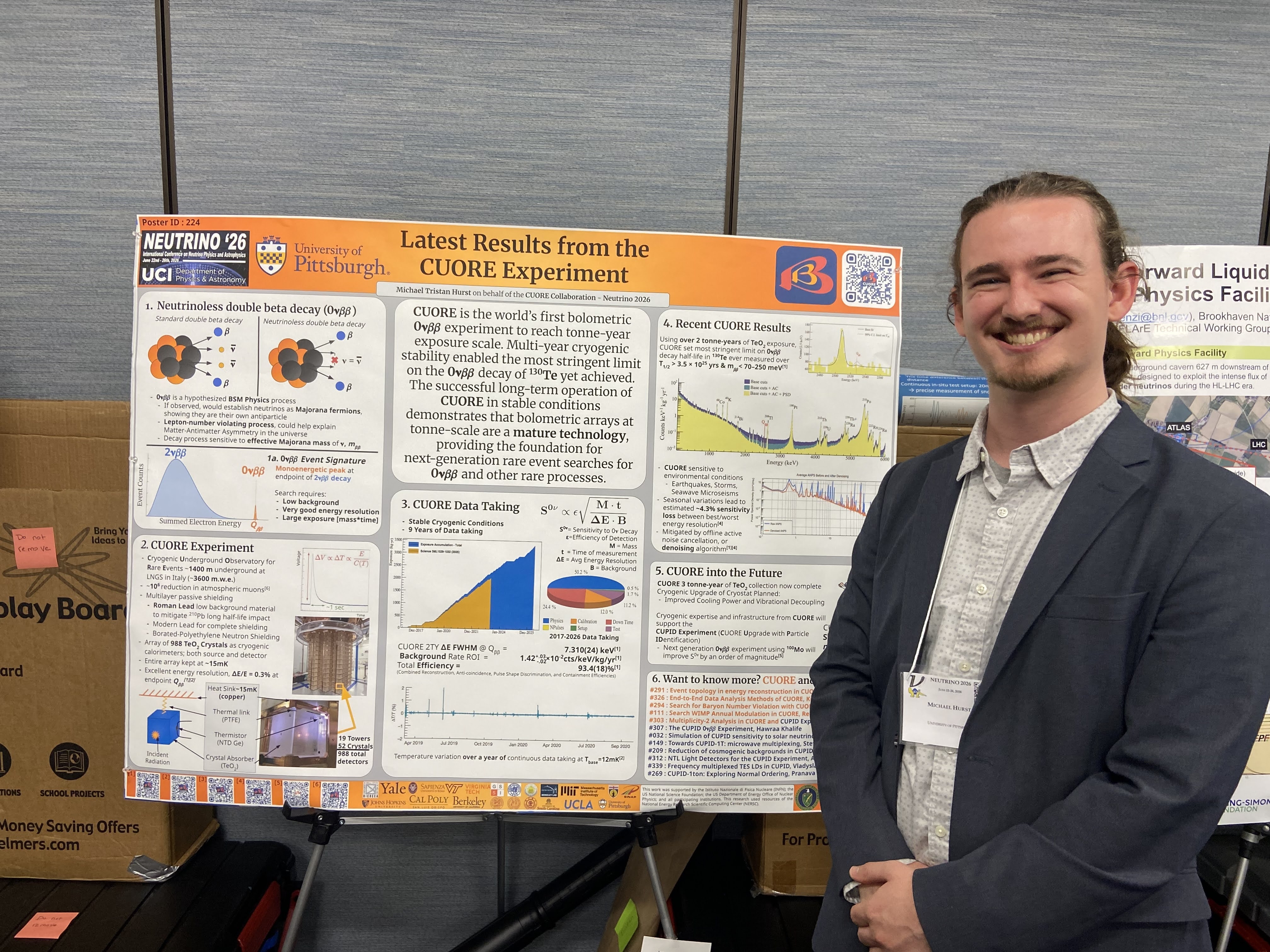 Tristan Hurst presenting a CUORE overview poster at Neutrino 2026