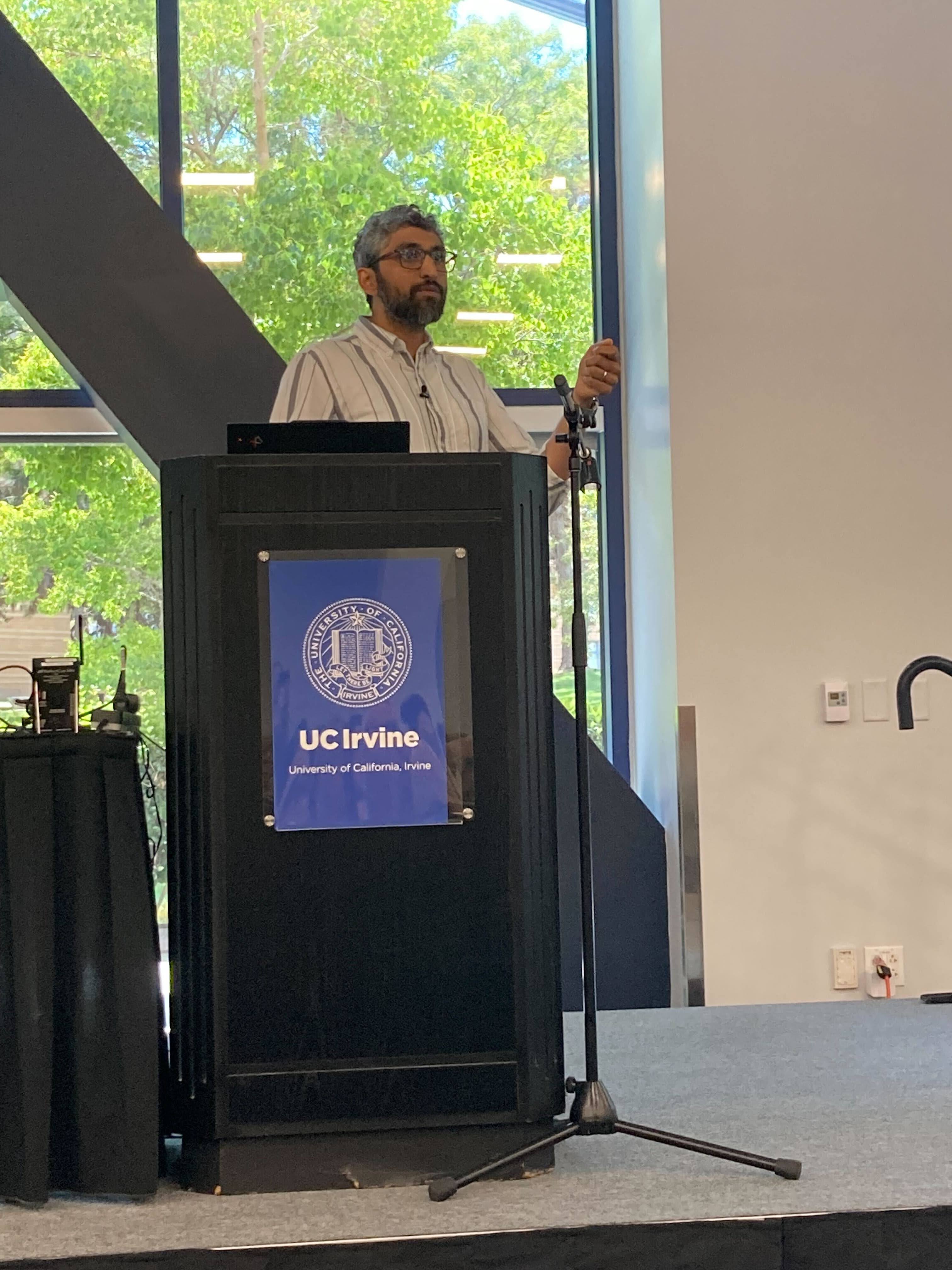 Pranava giving an invited talk at Neutrino 2026